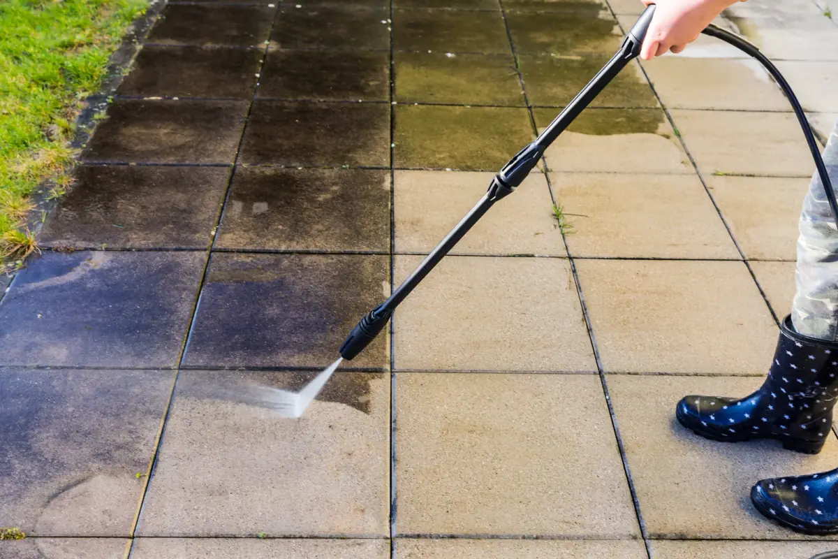 Pressure washing restoring patio pavers